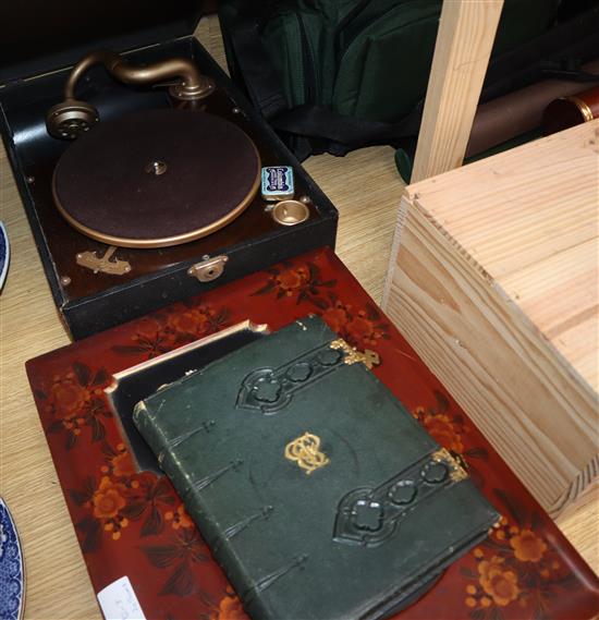 A Japanese lacquer album containing loose photos and watercolours and a Morocco leather album of envelope stamps